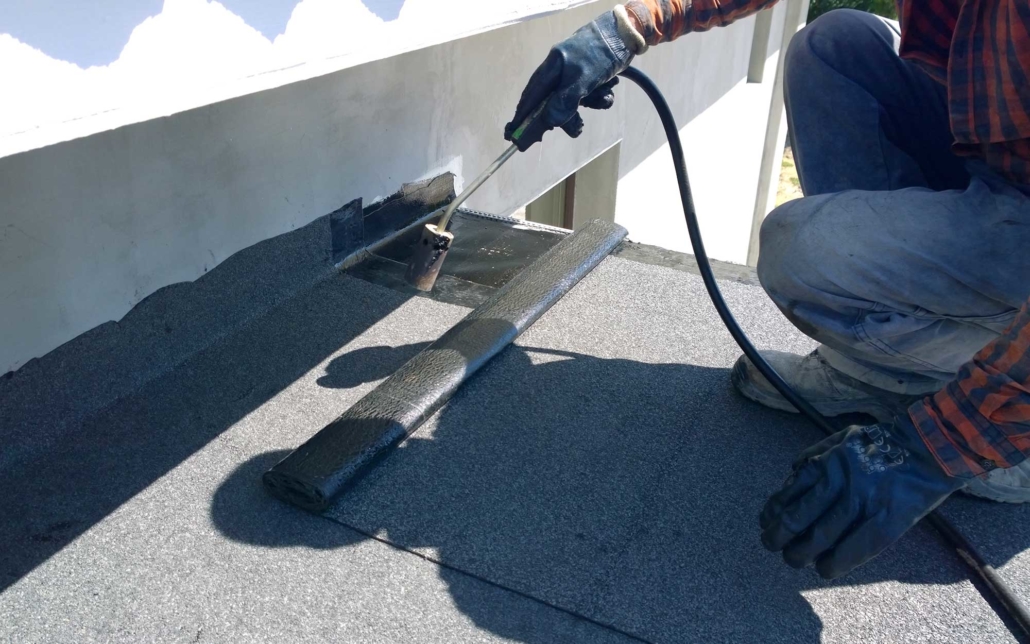 worker maintaining a commercial roof