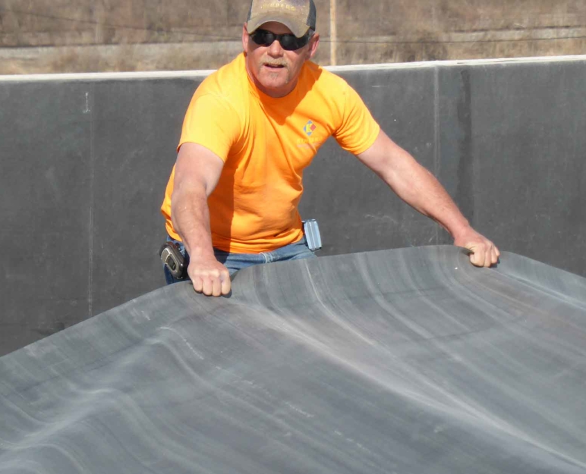 man installing an EPDM flat roof