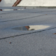 How to Handle Flat Roof Wind Damage